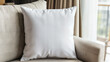 © Erich - Close-up of a white linen pillow. Harmoniously decorative depiction of a minimalist living room chair with a pillow in the cozy home