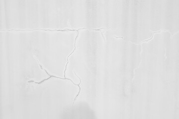 Wall Mural - Cement white wall with a large crack copy space for text. Grunge concrete cement white wall with a crack background and texture.