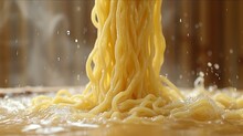  A Close Up Of A Bunch Of Noodles Being Sprinkled On Top Of Each Other With Water Coming Out Of The Top Of The Sprinklers On The Noodles.