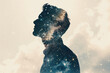 © Formoney - double exposure image of a man's silhouette filled with a starry night sky.