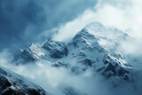 Fototapeta Góry - clouds form on snow covered mountains