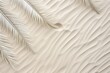 Tranquil zen pattern in white sand with relaxing palm leaves, ideal for meditation and mindfulness