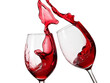 Two red wine glasses up and splash, close up on white background