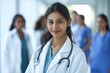 © Darya Lavinskaya - Portrait of smiling Indian female doctor in a hospital. Healthcare, medical staff