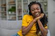 © zinkevych - Cute african american woman in yellow tshirt smiling nicely