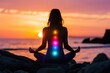 © darshika - Woman practicing yoga and meditation on beach at sunset.