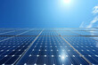 Environment concept, Modern solar panels extending towards the sun under a clear blue sky, symbolizing renewable energy...