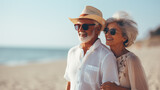 Fototapeta  - An elderly couple stand and smile happy feeling and chilling on the beach.
