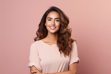 Happy smiling young beautiful woman in casual clothes, over pink background.