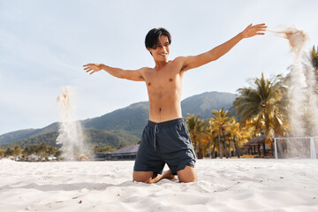 Wall Mural - Muscular Asian Man on Beach, Enjoying Tropical Vacation with a Smile