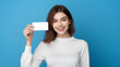 © Atthawut - Russian female happy face holding blank paper