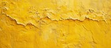 Fototapeta  - Abstract background with a yellow concrete wall and decorative plaster layer.