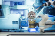 Close-up industrial gripping and welding robotic working with metalwork on smart factory assembly line concept with blue tone background, industry 4.0 and automation working via no people control 