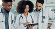 © Felix/peopleimages.com - Tablet, team doctors and woman typing, reading or teamwork on medicine study, cardiology research or healthcare. Cooperation, hospital and medical surgeon, nurse or clinic group review online service
