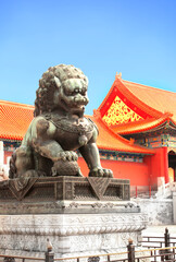 Sticker - Ancient pavilions and lion statue in Forbidden City. Bronze chinese guardian lion in front of Gate of Supreme Harmony, Forbidden City, Beijing, China