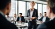 © Stock Pix - a boardroom setting, of a mature businesswoman confidently presenting her ideas to a group of attentive colleagues