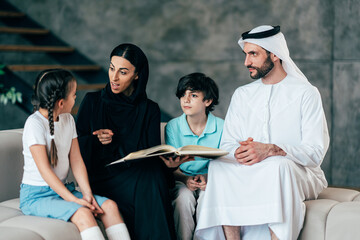 Traditional arabian family from Dubai spending time together at home