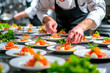 © NORN - Chef Garnishing Plates with Precision in Kitchen.