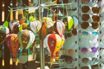 Wall Mural - Handmade ceramics souvenirs in form of colorful hot air balloon selling in gift shop in Goreme. Toning. Typical souvenir or gift from Cappadocia, Turkey (Turkiye)