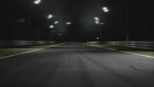 Two Modern Race Cars Racing On A Speedway At Night