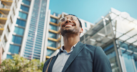 Canvas Print - Asian businessman, city and happy by office buildings in morning, view and travel to workplace in accounting career. Young lawyer, positive and professional with ambition and working in town in cbd