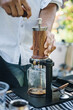 a man make coffee with aram coffee maker machine