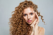 © artmim - Stylish healthy model with natural make-up, shiny clear skin and long curly hairstyle. Haircare, Skincare, Cosmetology and Styling concept