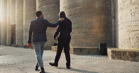 Poster - City, talking and walking with business men outdoor together on morning commute to corporate job. Collaboration, travel or conversation with mentor and employee on sidewalk or street of urban town