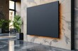 Black square signboard on the marble wall of a modern business center, mockup