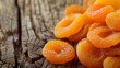 A Pile of Dried Apricots on a Wooden Table