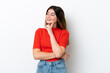 © luismolinero - Young caucasian woman isolated on white background thinking an idea while looking up