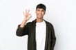 © luismolinero - Young man over isolated white background showing ok sign with fingers