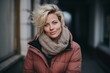 © Iigo - Portrait of a beautiful blonde woman in a pink jacket and scarf