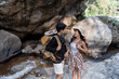 © itchaznong - Happy LGBT Lesbian couple Travelers Hiking with Backpacks in waterfall Trail. LGBT Lesbian Couple Hikers with backpacks walks in mountains in vacation