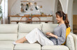 © Art_Photo - Young smiling asian woman relax using laptop conference work,learning education,study online,webinar podcast,creative woman looking at screen, shopping, online marketing at home
