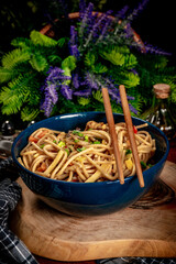 Canvas Print - Fried noodles with chicken and vegetables.