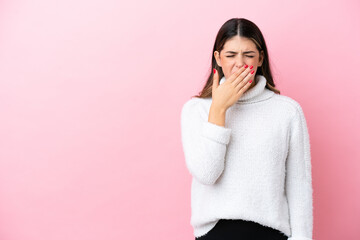 Wall Mural - Young Italian woman isolated on pink background yawning and covering wide open mouth with hand