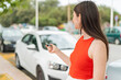 © luismolinero - Young pretty woman at outdoors holding car keys