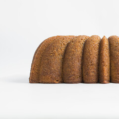 Sticker - Homemade pound cake loaf on a white table, fresh brown sugar loaf cake on a white background