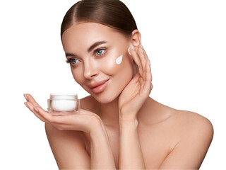 Wall Mural - beauty woman applying cream on her face. young woman with clean fresh skin. model with a jar of face