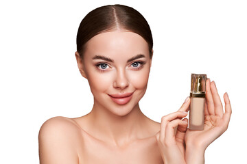 Wall Mural - portrait beautiful young woman with clean fresh skin. model with foundation makeup bottle. cosmetolo