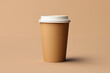 A recyclable eco-friendly cardboard cup with takeaway coffee isolated on a kraft paper background