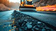 Using road construction resources, a worker is installing new asphalt road surface with space, Generative AI.