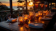 © JVLMediaUHD - A luxurious table in a restaurant with a view of the sunset, where candles and candelabra create a