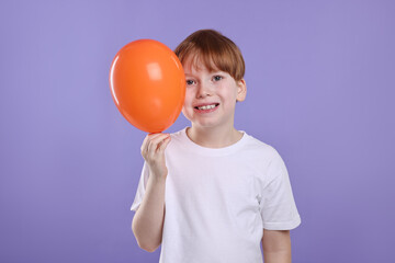 Sticker - Boy with orange balloon on violet background