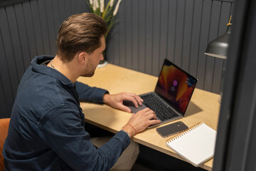 Businessman working on laptop in office