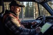 © Photocreo Bednarek - Truck driver checking GPS on tablet during sunrise
