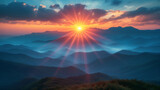 Fototapeta Góry - Sunset in the mountains, sunbeams radiate through clouds over a mountainous landscape, showcasing a breathtaking sunrise or sunset