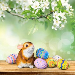 Canvas Print - Painted colored Easter eggs and bunny on the desk