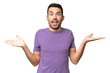 © luismolinero - Young handsome caucasian man over isolated background with shocked facial expression